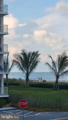 a view of a backyard with sitting area