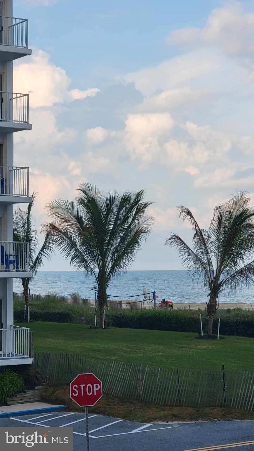 11 91st Street, Unit 102 Ocean City, MD 21842 - Photo 27 of 43 a view of a table and chairs in the garden