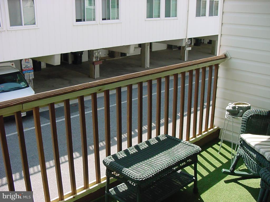11 91st Street, Unit 102 Ocean City, MD 21842 - Photo 3 of 43 a view of a chairs and table in the balcony
