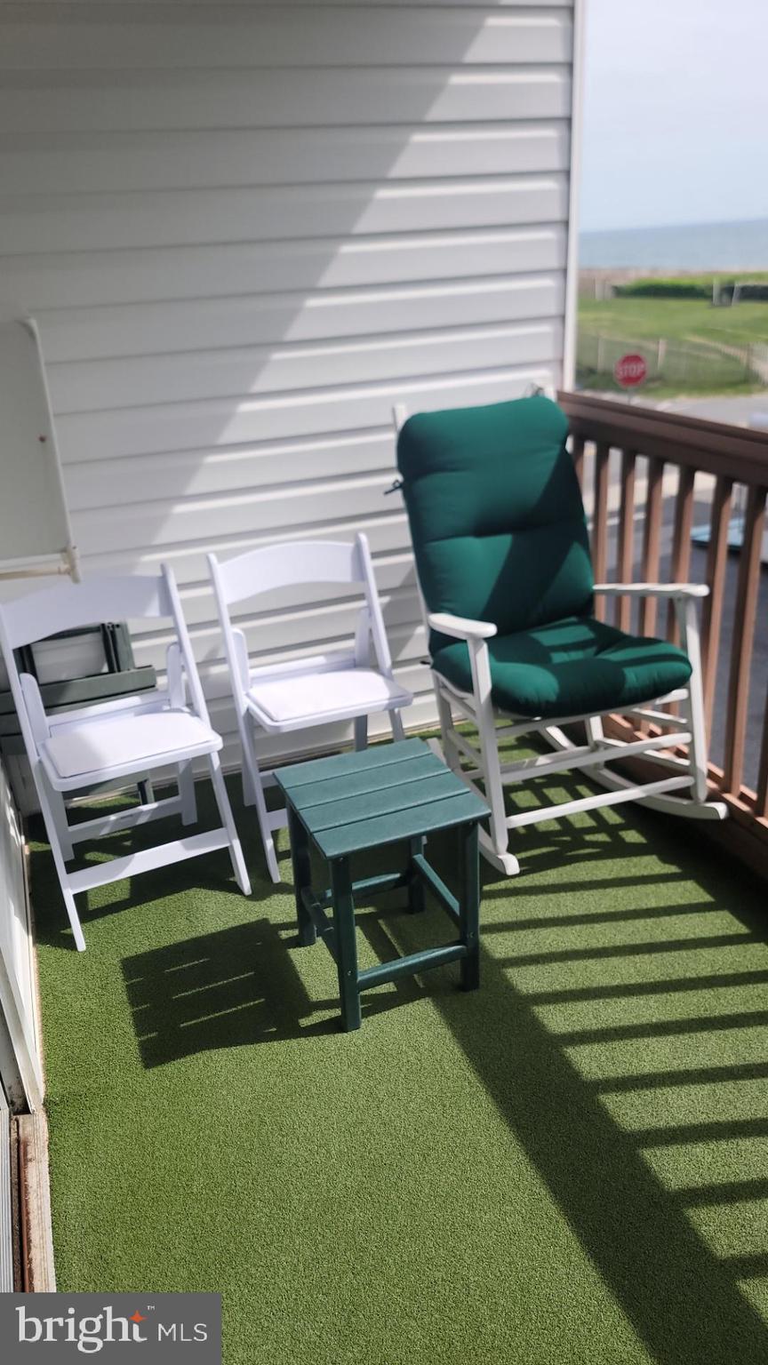 11 91st Street, Unit 102 Ocean City, MD 21842 - Photo 34 of 43 a backyard of a house with outdoor seating