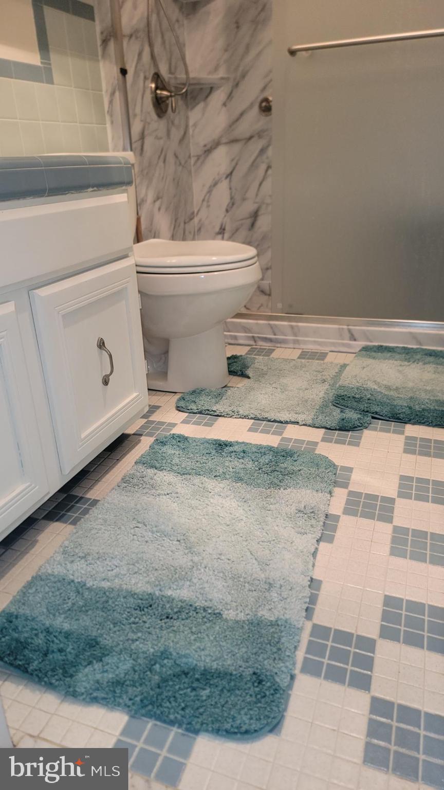 11 91st Street, Unit 102 Ocean City, MD 21842 - Photo 38 of 43 a bathroom with a toilet and a shower