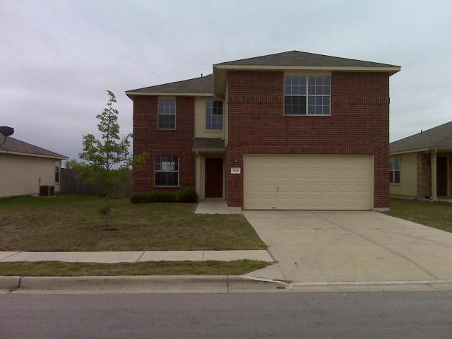 604 Lavaca Loop Elgin, TX 78621 - Photo 1 of 1 a front view of a house with a yard