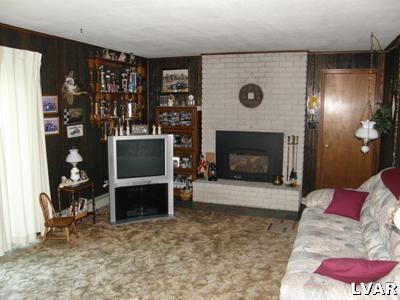 220 Barlieb Road Nazareth, PA 18064 - Photo 5 of 8 a living room with furniture and a fireplace