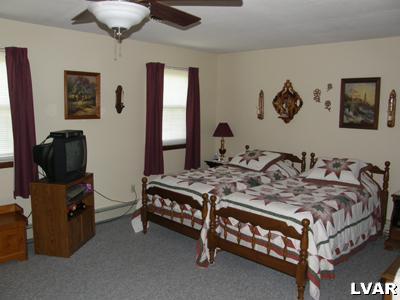 220 Barlieb Road Nazareth, PA 18064 - Photo 7 of 8 a bedroom with a bed and a night stand