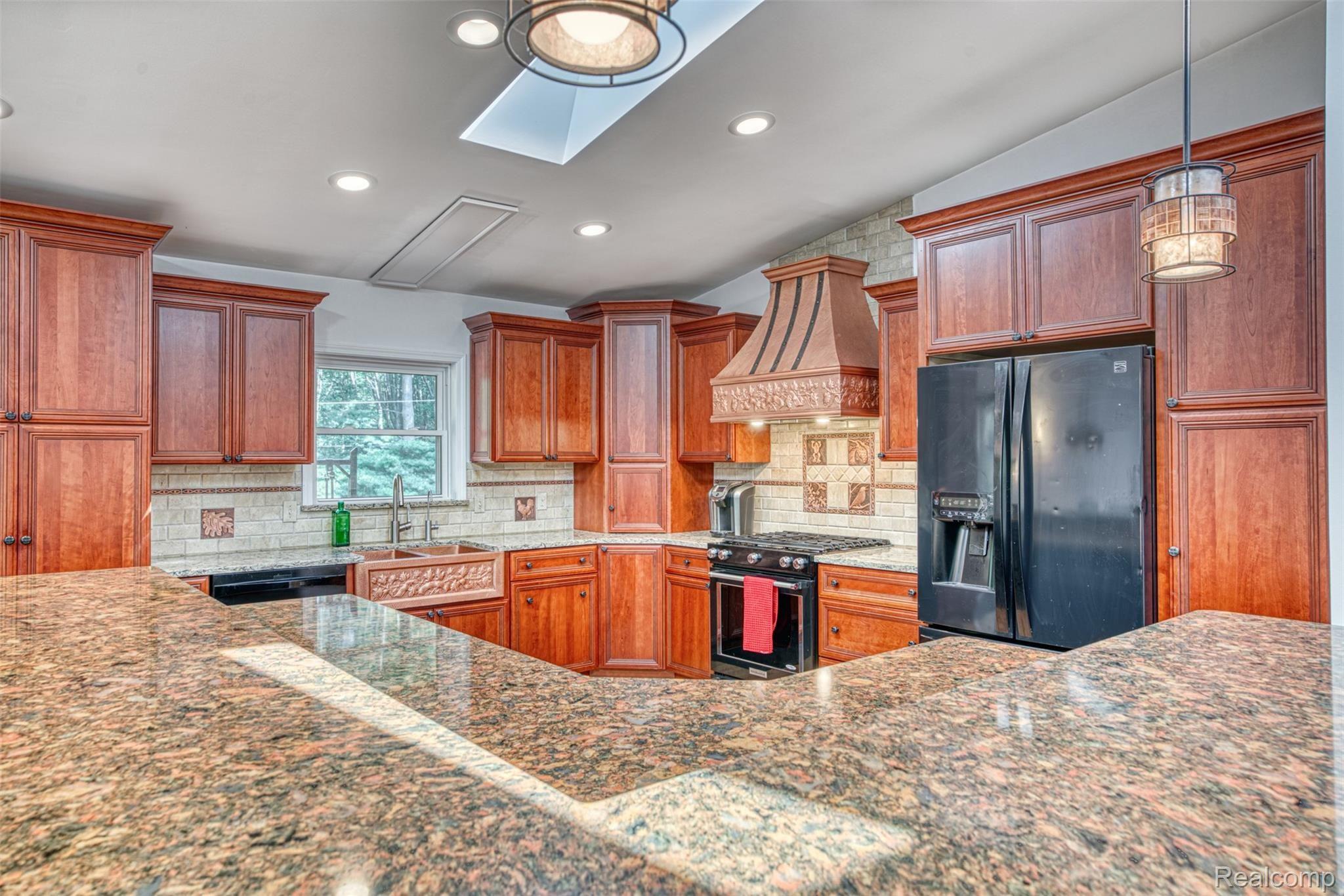 11813 Newman Road Brighton, MI 48114 - Photo 6 of 33 Gourmet kitchen-cherry cabs, quartz, copper sink