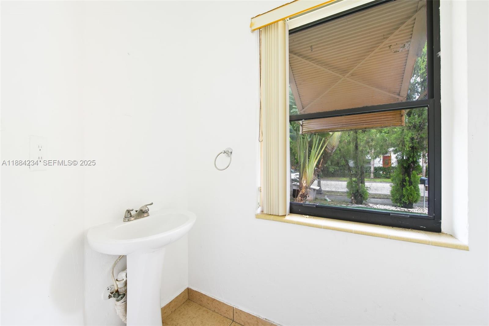 1932 Adams Street Hollywood, FL 33020 - Photo 8 of 11 a bathroom with a sink and a mirror