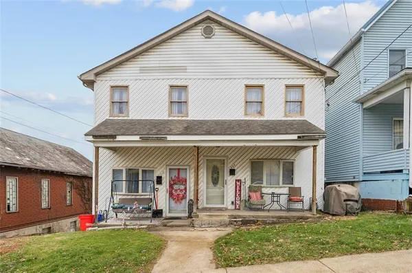 a front view of the house with yard