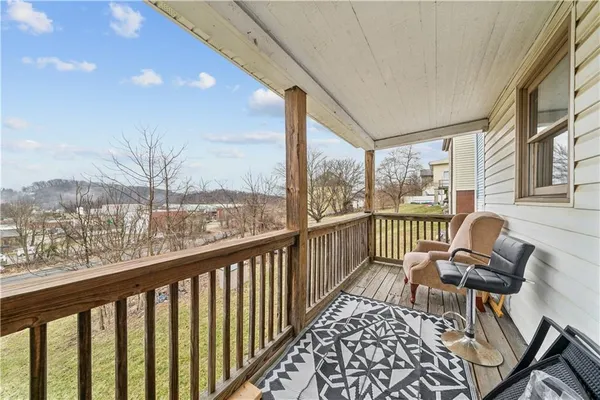 a view of balcony with furniture