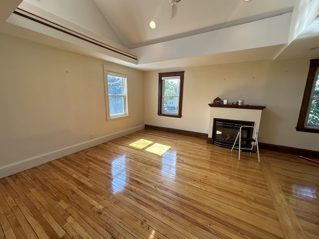 17 Herbert Road, Unit 1 Arlington, MA 02474 - Photo 11 of 26 a view of empty room with wooden floor and fan