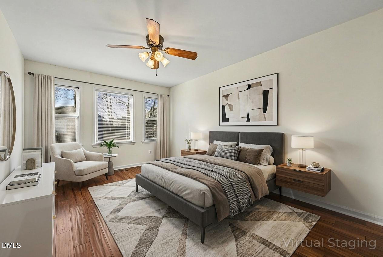 112 Rock Pointe Lane Cary, NC 27513 - Photo 13 of 35 a bedroom with a large bed couch and a window