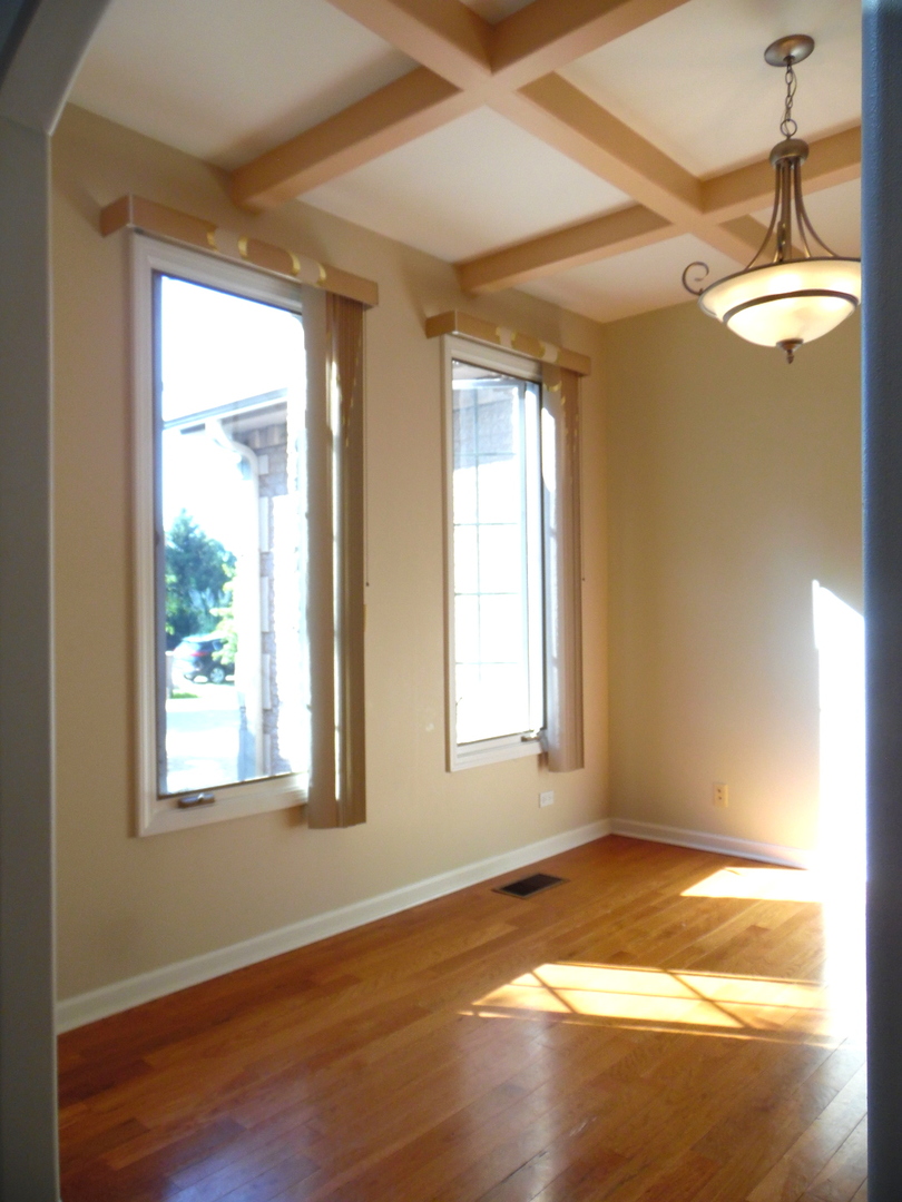 19057 South Saddlebrook Drive Shorewood, IL 60404 - Photo 20 of 56 a view of empty room with wooden floor and fan