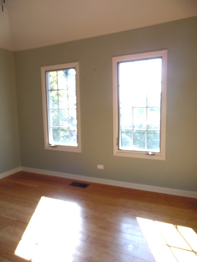 19057 South Saddlebrook Drive Shorewood, IL 60404 - Photo 28 of 56 an empty room with wooden floor and windows