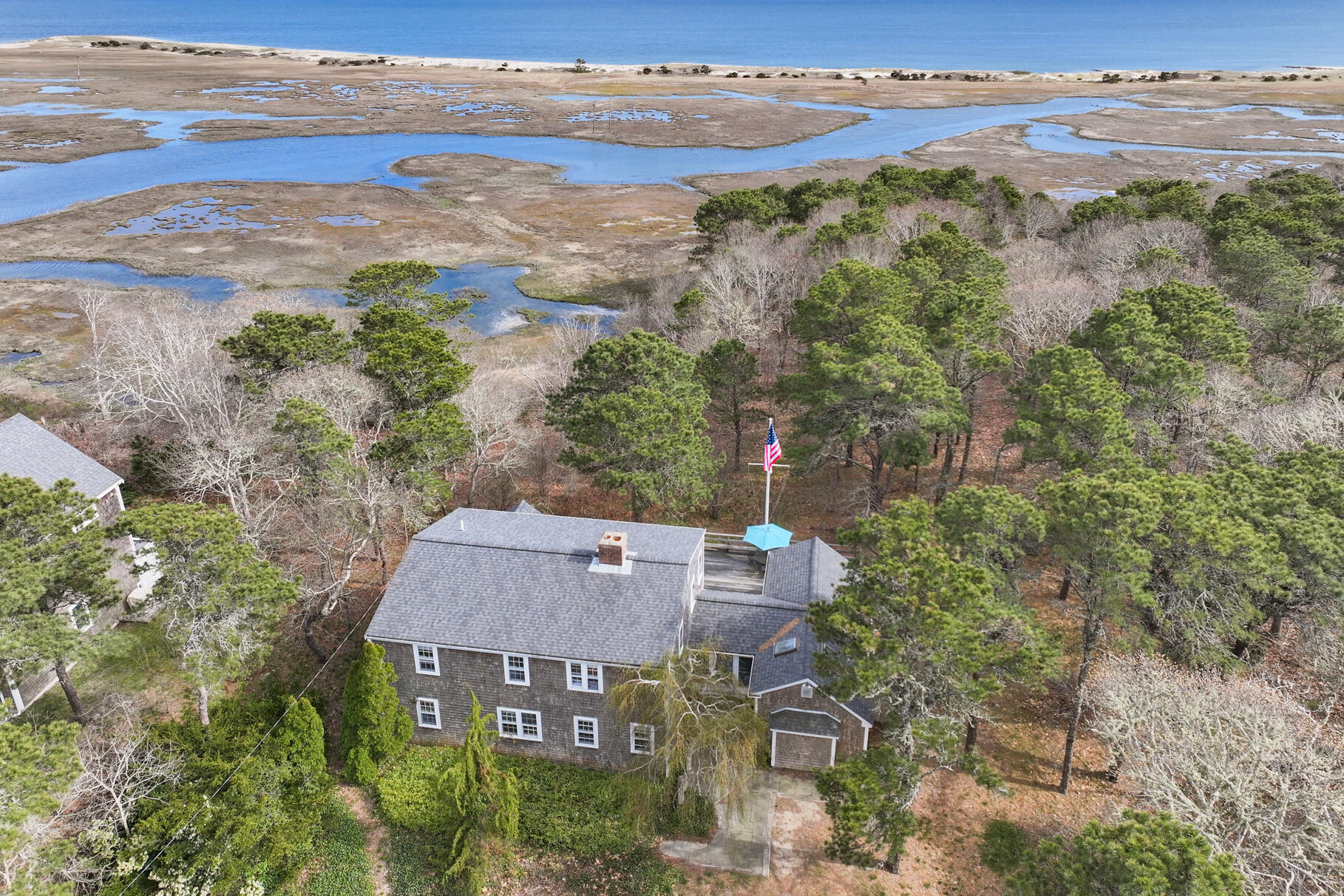 an aerial view of a house with ocean view