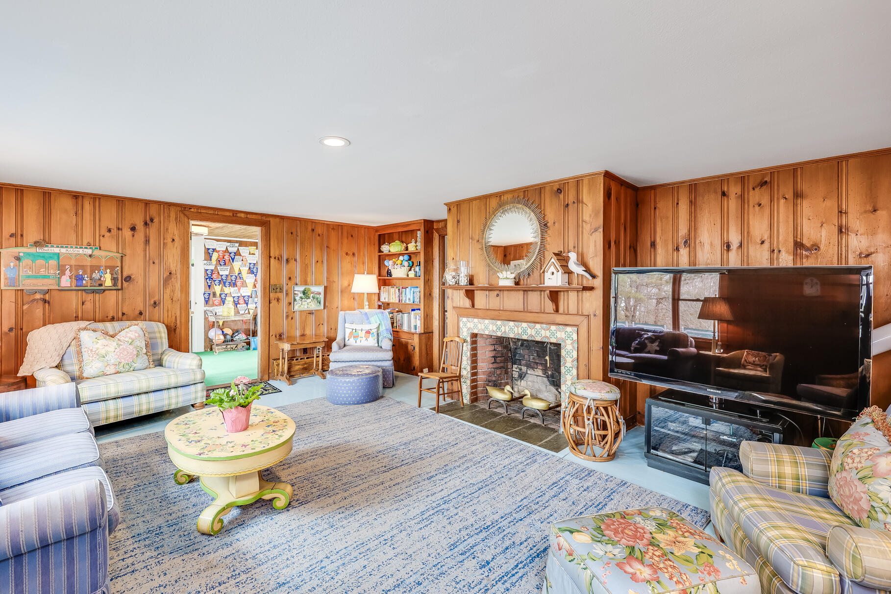 189 Bay View Road Chatham, MA 02659 - Photo 19 of 59 a living room with furniture a fireplace and a flat screen tv