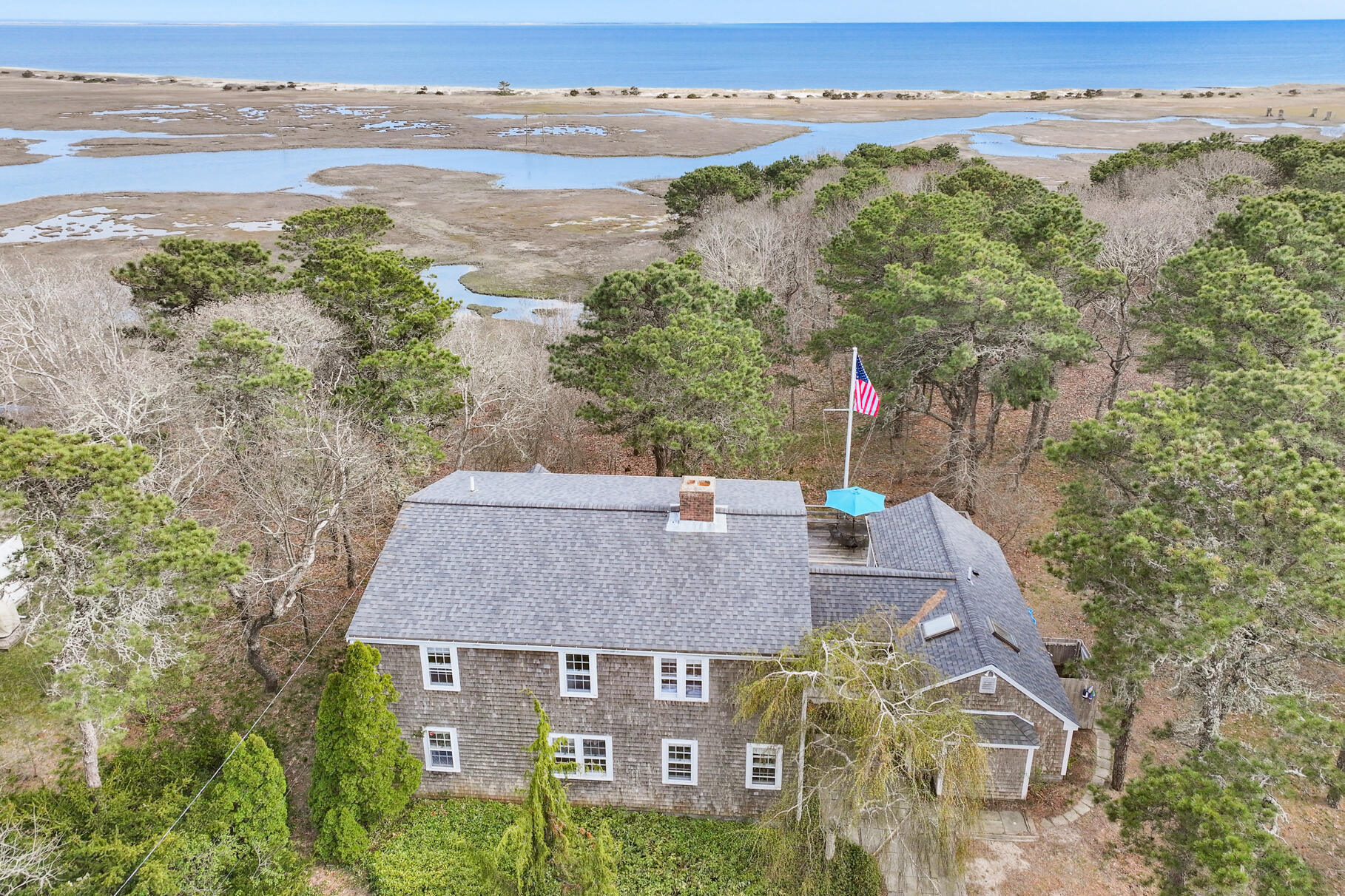189 Bay View Road Chatham, MA 02659 - Photo 2 of 59 an aerial view of a house with a garden and lake view