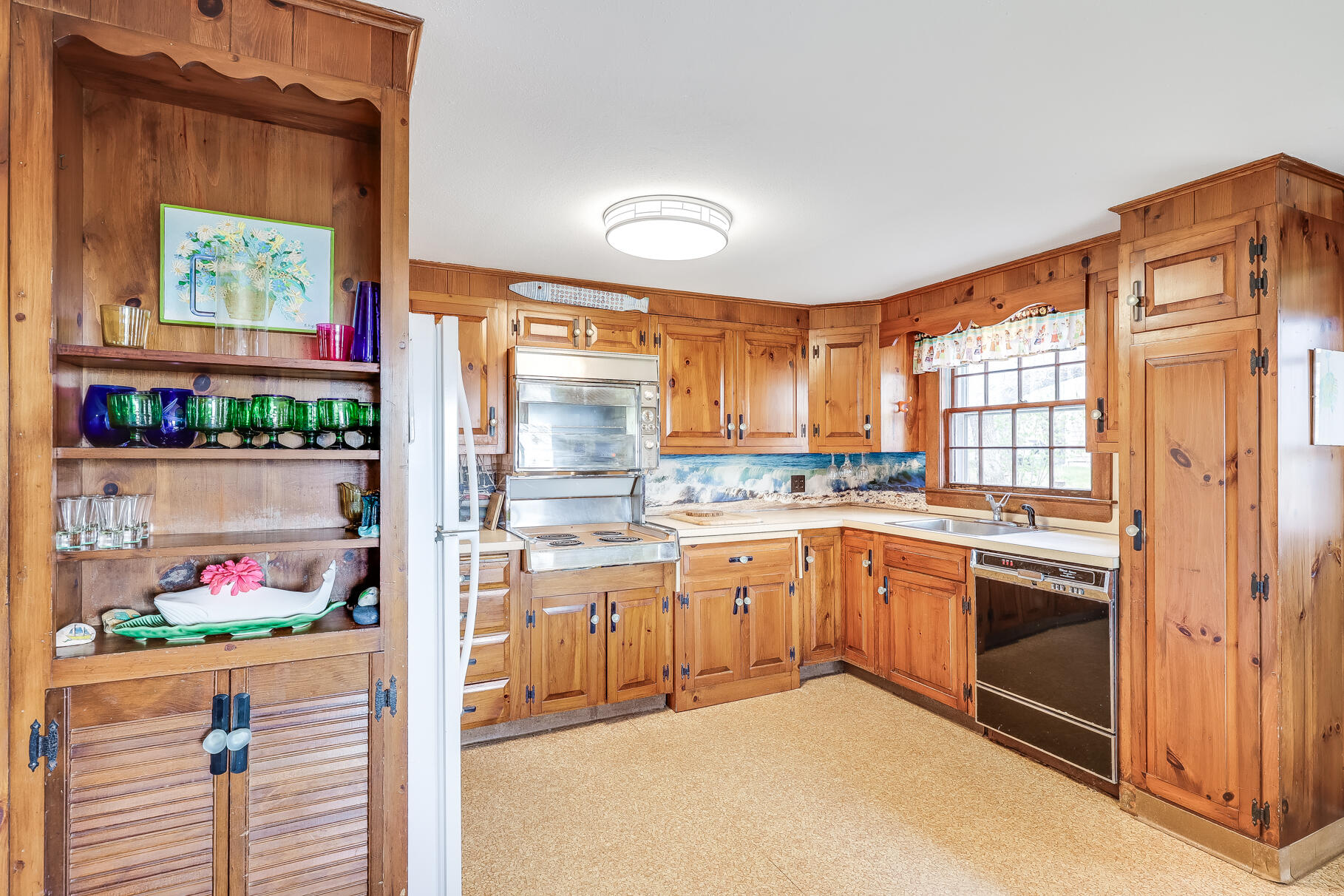 189 Bay View Road Chatham, MA 02659 - Photo 22 of 59 a kitchen with stainless steel appliances granite countertop a stove and a refrigerator