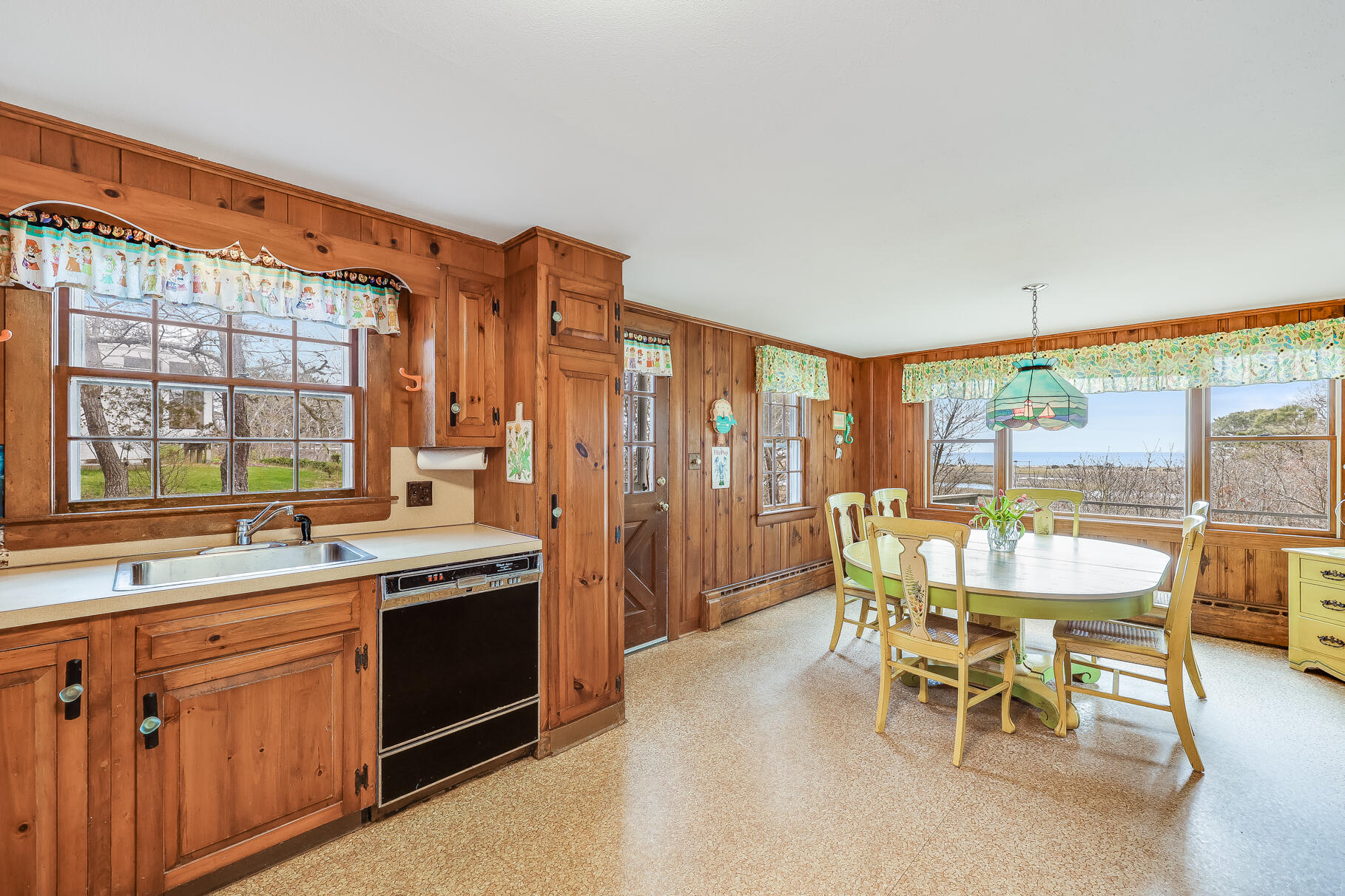189 Bay View Road Chatham, MA 02659 - Photo 24 of 59 a dining hall with stainless steel appliances granite countertop a stove a sink and a refrigerator