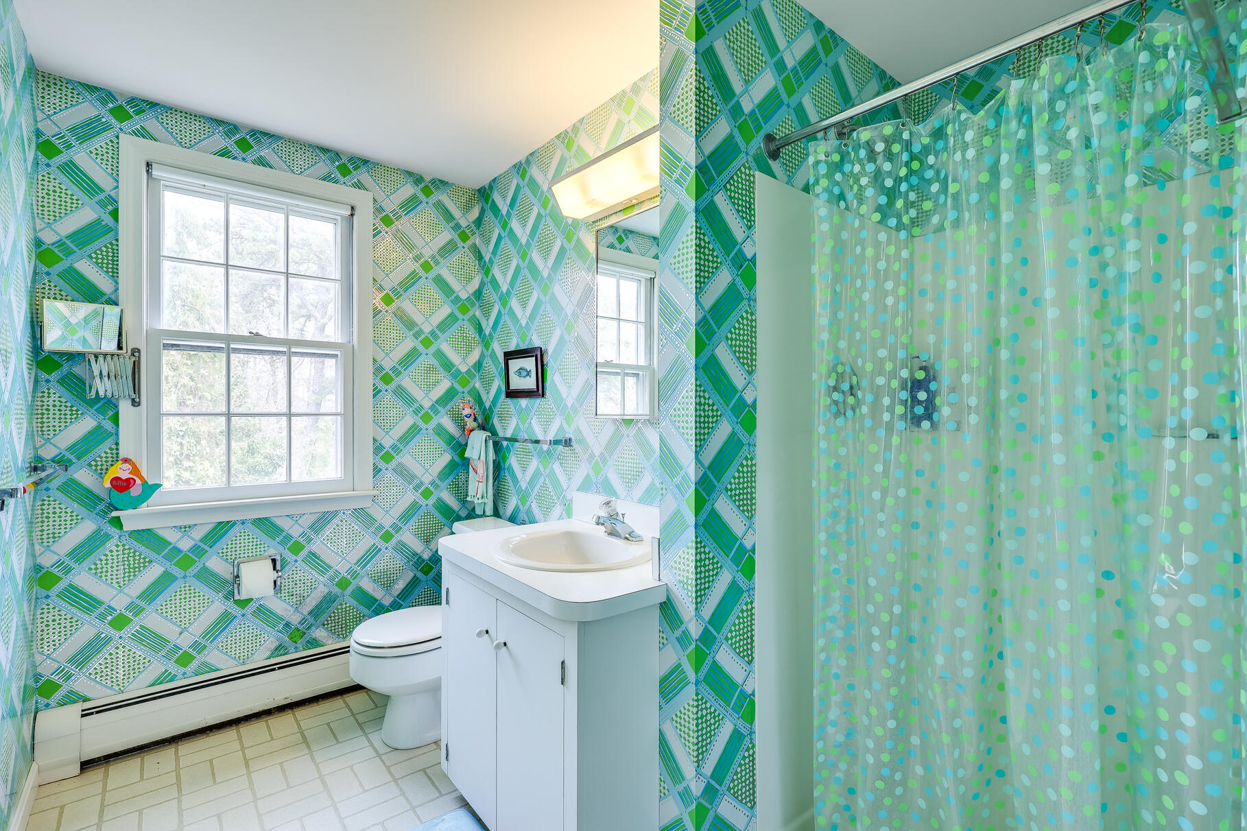 189 Bay View Road Chatham, MA 02659 - Photo 37 of 59 a view of a bathroom with a toilet and a shower curtain