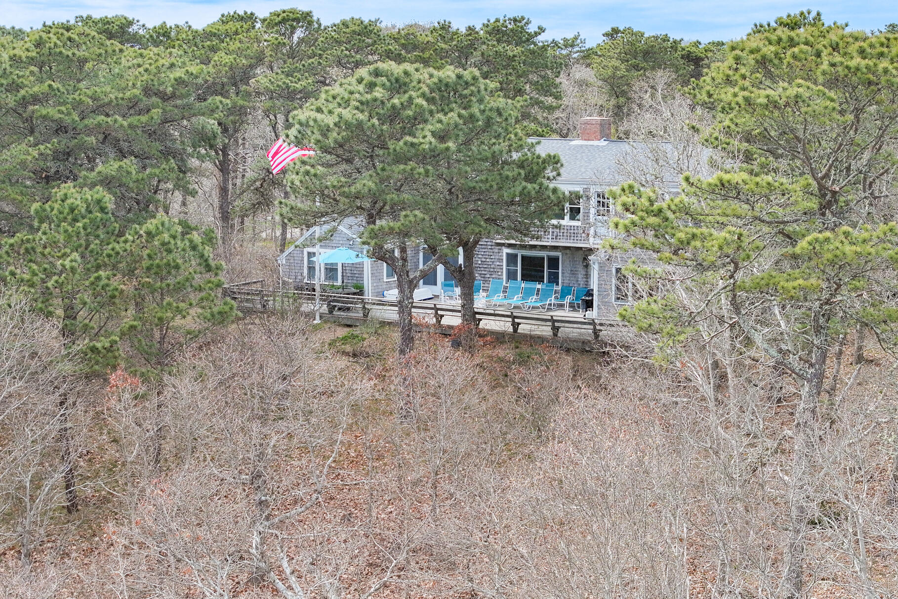 189 Bay View Road Chatham, MA 02659 - Photo 4 of 59 a front view of house with yard and trees in the background