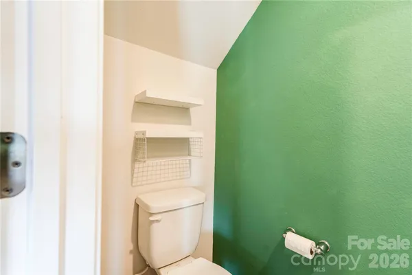 a bathroom with a toilet and a sink