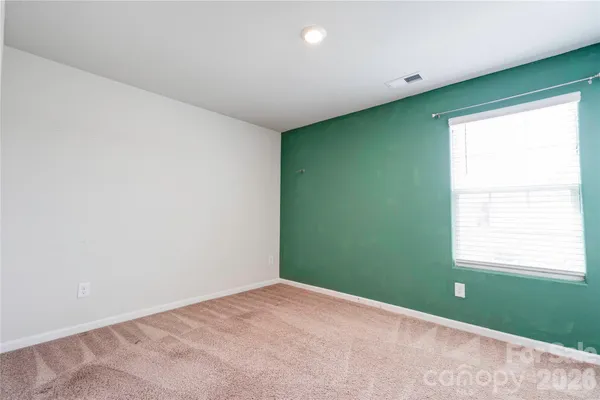 a view of a room that has a window in it