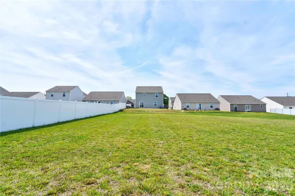 a view of a houses with a big yard