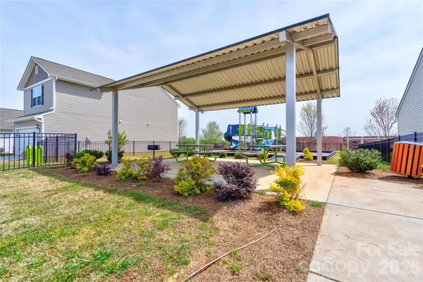 a view of a chairs and table in patio