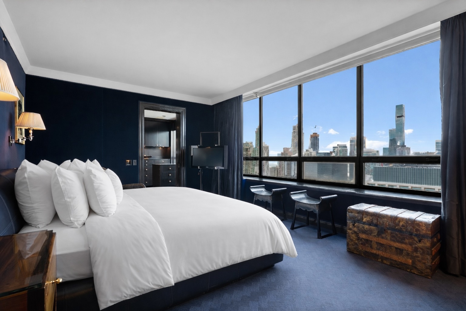 180 East Pearson Street, Unit 3304 Chicago, IL 60611 - Photo 8 of 17 a bedroom with a bed and wooden floor