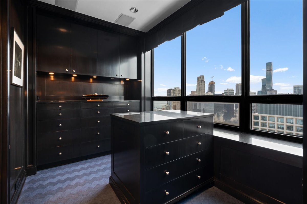 180 East Pearson Street, Unit 3304 Chicago, IL 60611 - Photo 9 of 17 a view of a double vanity sink and a window