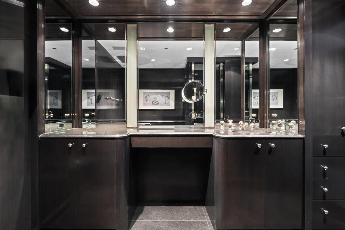 180 East Pearson Street, Unit 3304 Chicago, IL 60611 - Photo 10 of 17 a bathroom with a sink and a large mirror