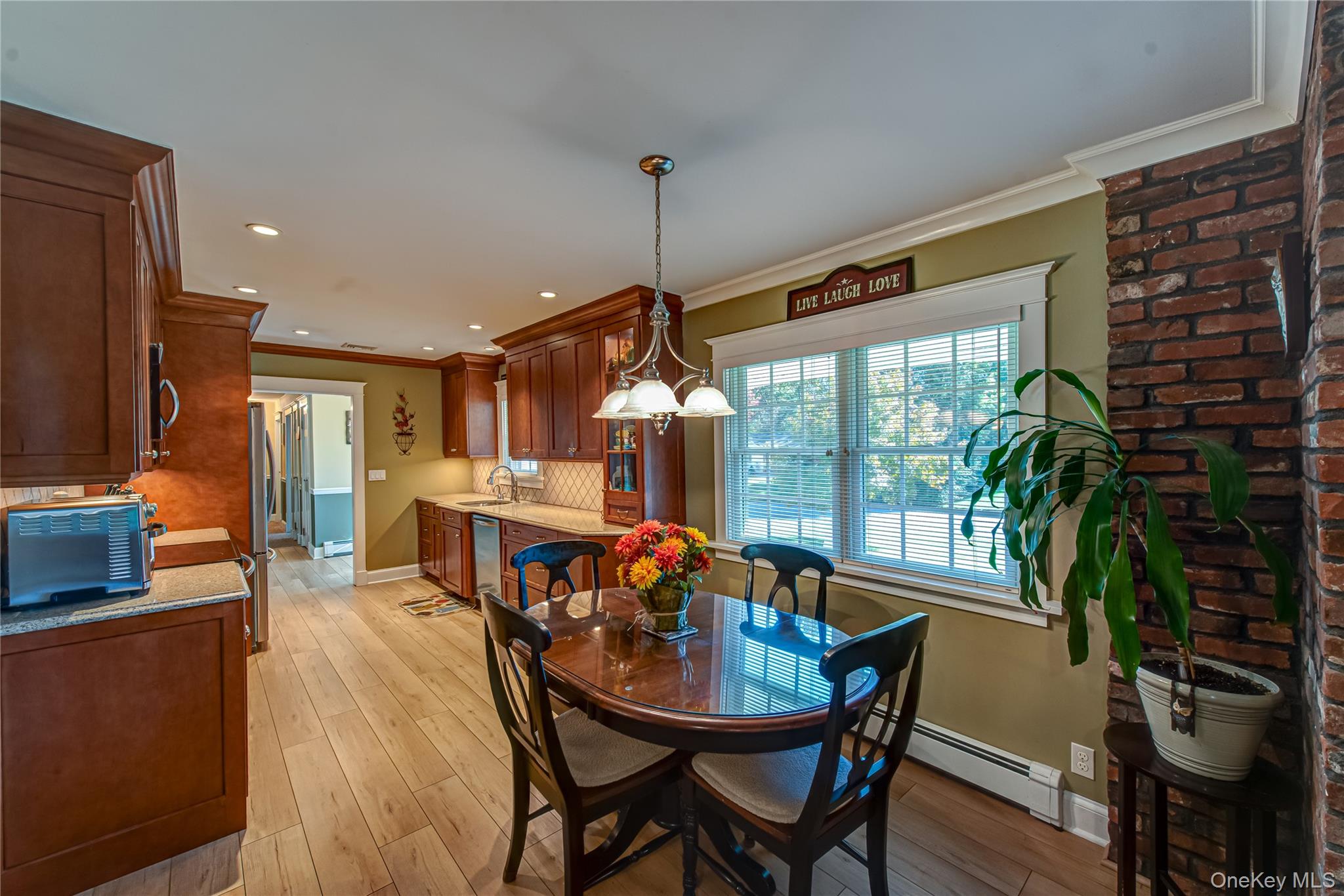 3 Walnut Road Rocky Point, NY 11778 - Photo 15 of 46 a dining room with furniture potted plants and wooden floor