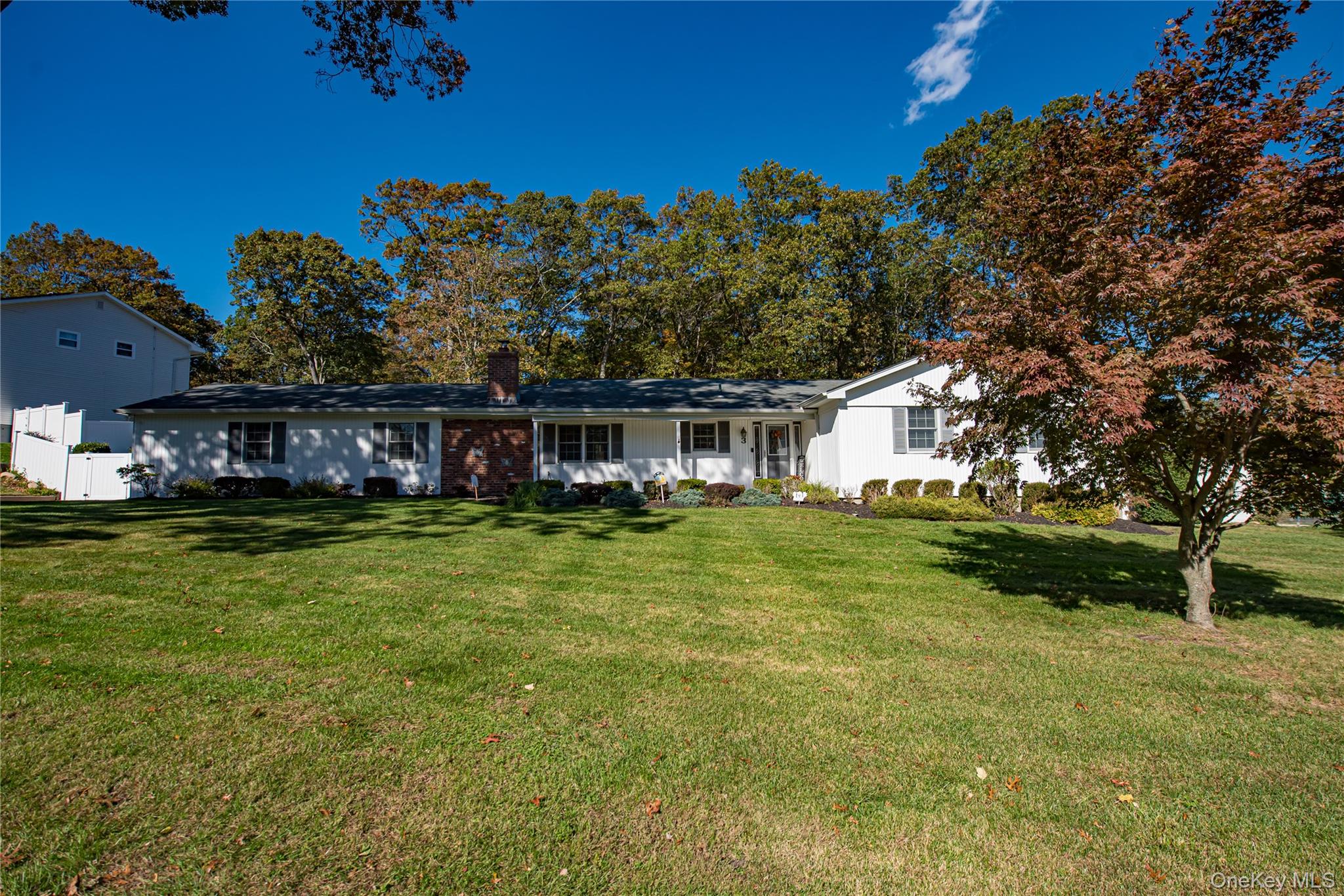 3 Walnut Road Rocky Point, NY 11778 - Photo 2 of 46 a front view of a house with a yard table and chairs