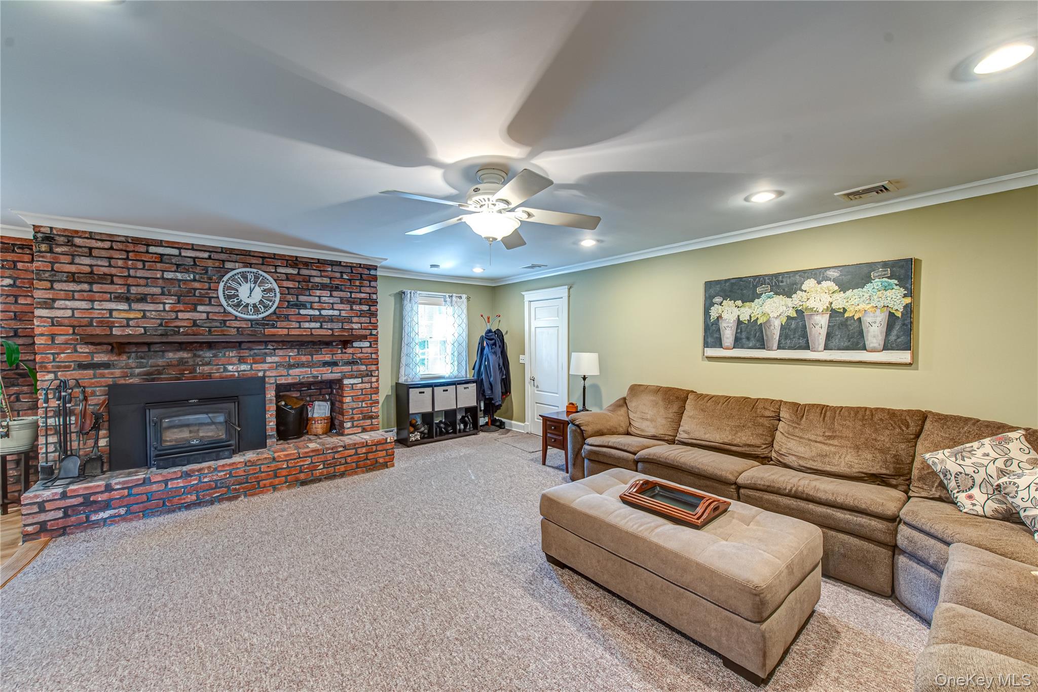3 Walnut Road Rocky Point, NY 11778 - Photo 21 of 46 a living room with furniture and a fireplace