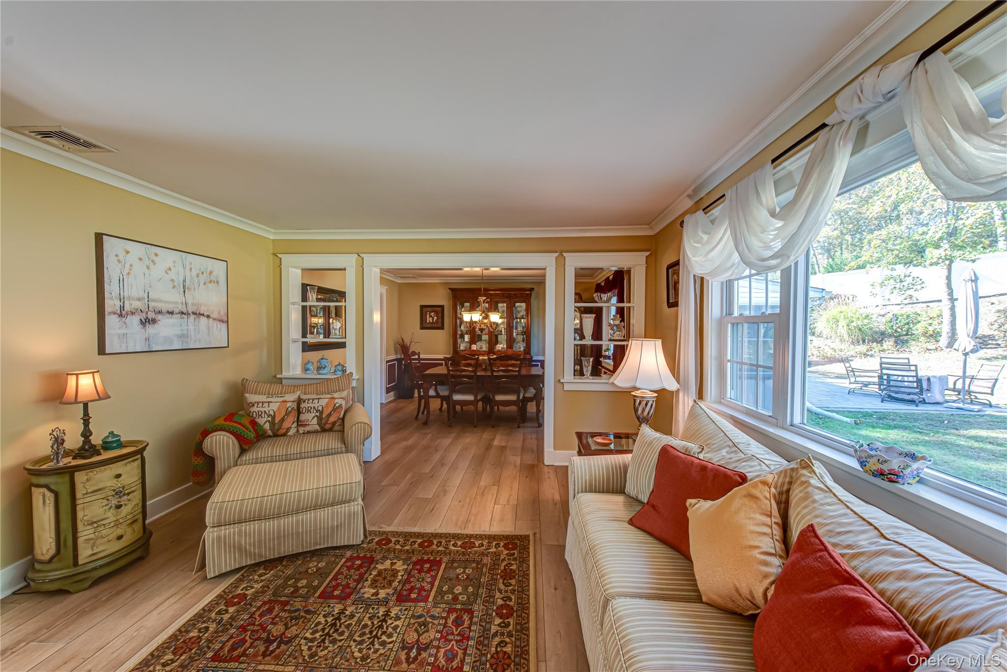 3 Walnut Road Rocky Point, NY 11778 - Photo 9 of 46 a living room with furniture floor to ceiling window and wooden floor