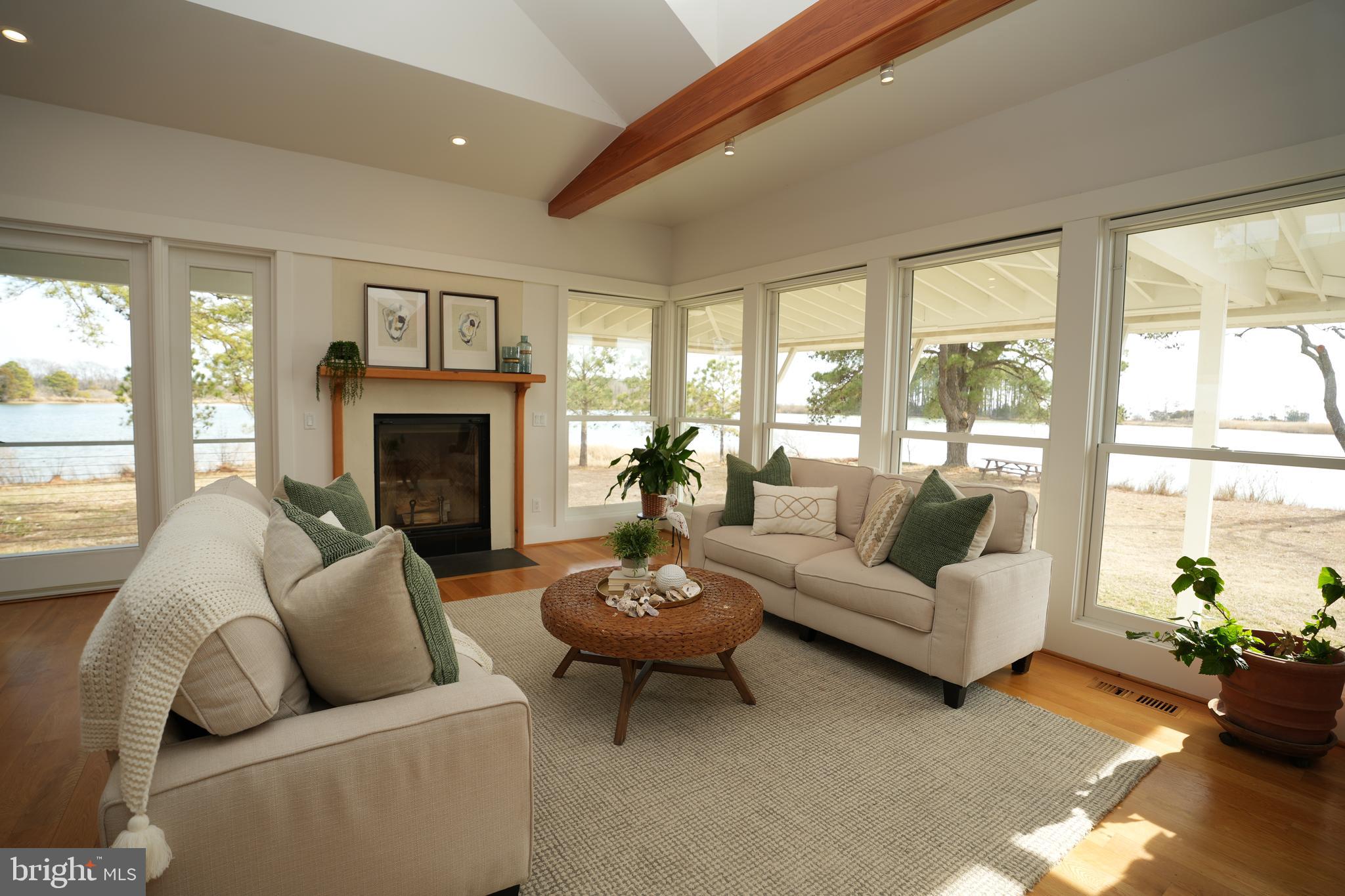 49005 Harry James Road Ridge, MD 20680 - Photo 16 of 71 a living room with furniture and a fireplace