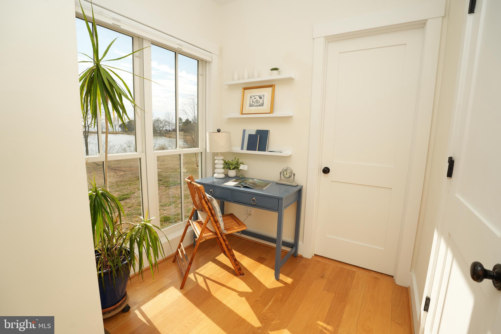 49005 Harry James Road Ridge, MD 20680 - Photo 32 of 71 a view of a workspace with furniture and a window