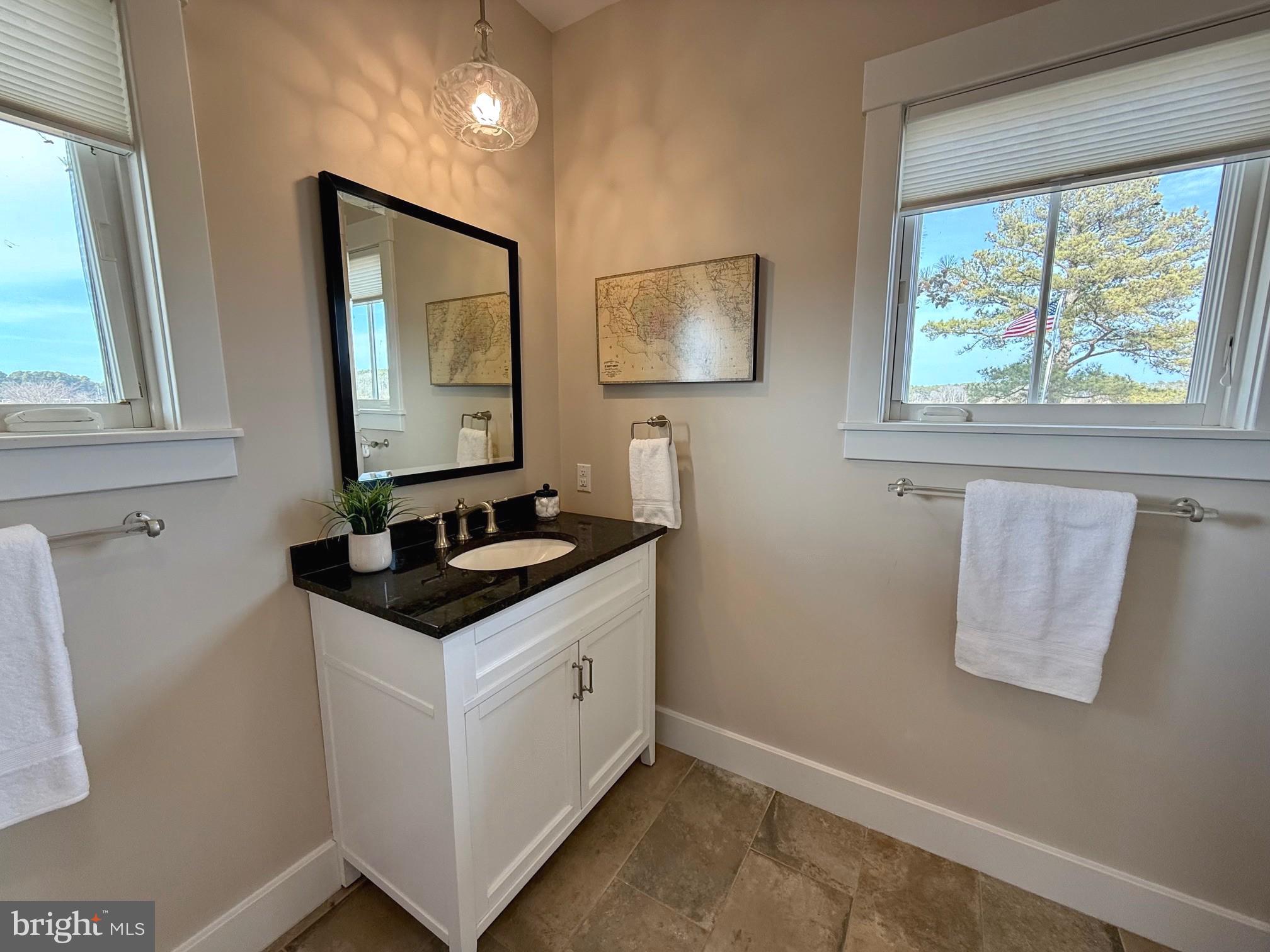 49005 Harry James Road Ridge, MD 20680 - Photo 36 of 71 a bathroom with a sink and a mirror