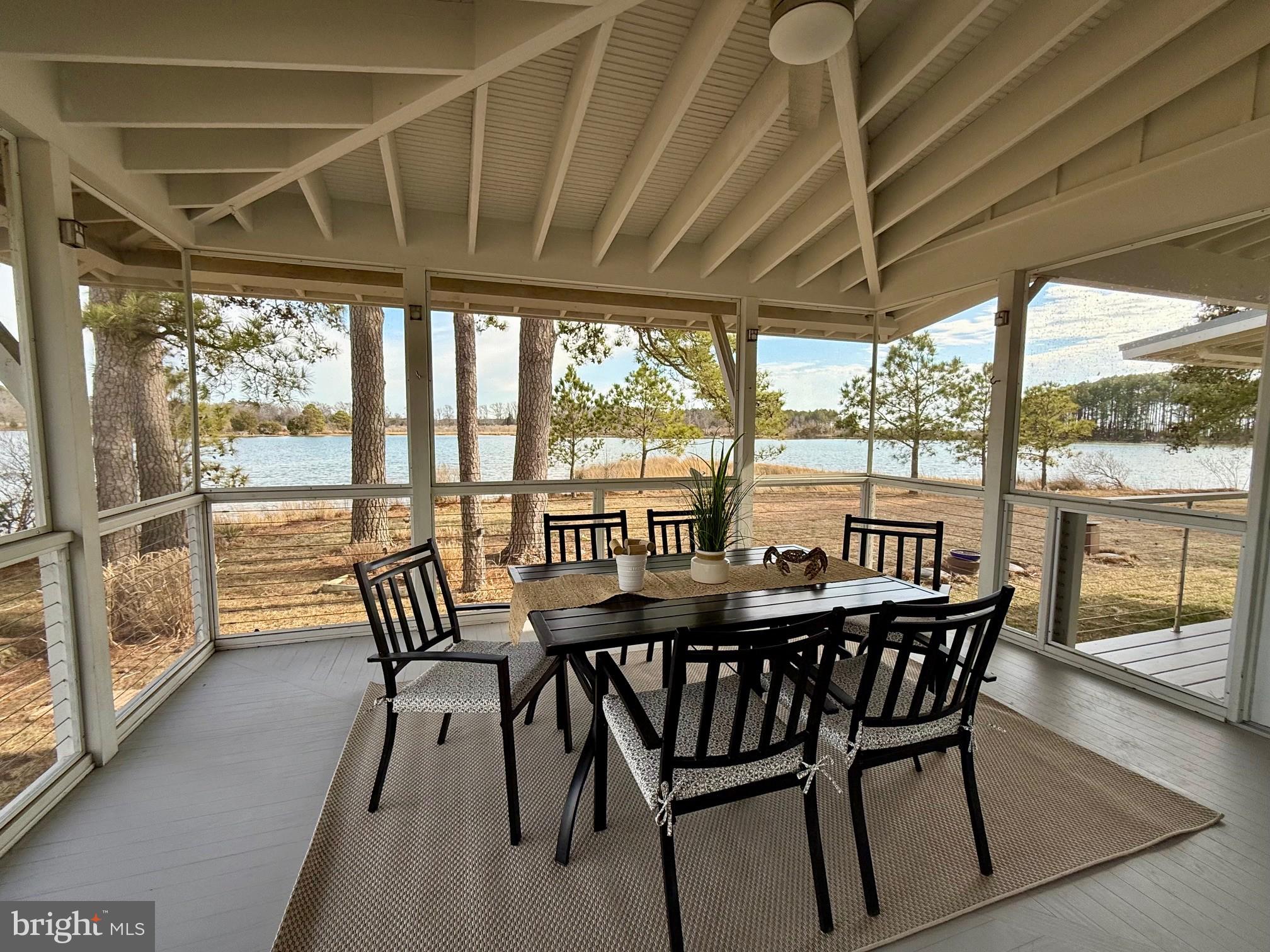 49005 Harry James Road Ridge, MD 20680 - Photo 41 of 71 a view of a chairs and table in patio with a yard