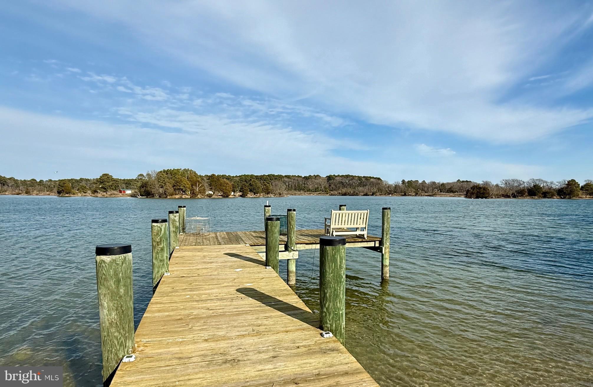 49005 Harry James Road Ridge, MD 20680 - Photo 62 of 71 a lake view with a wooden floor and city view