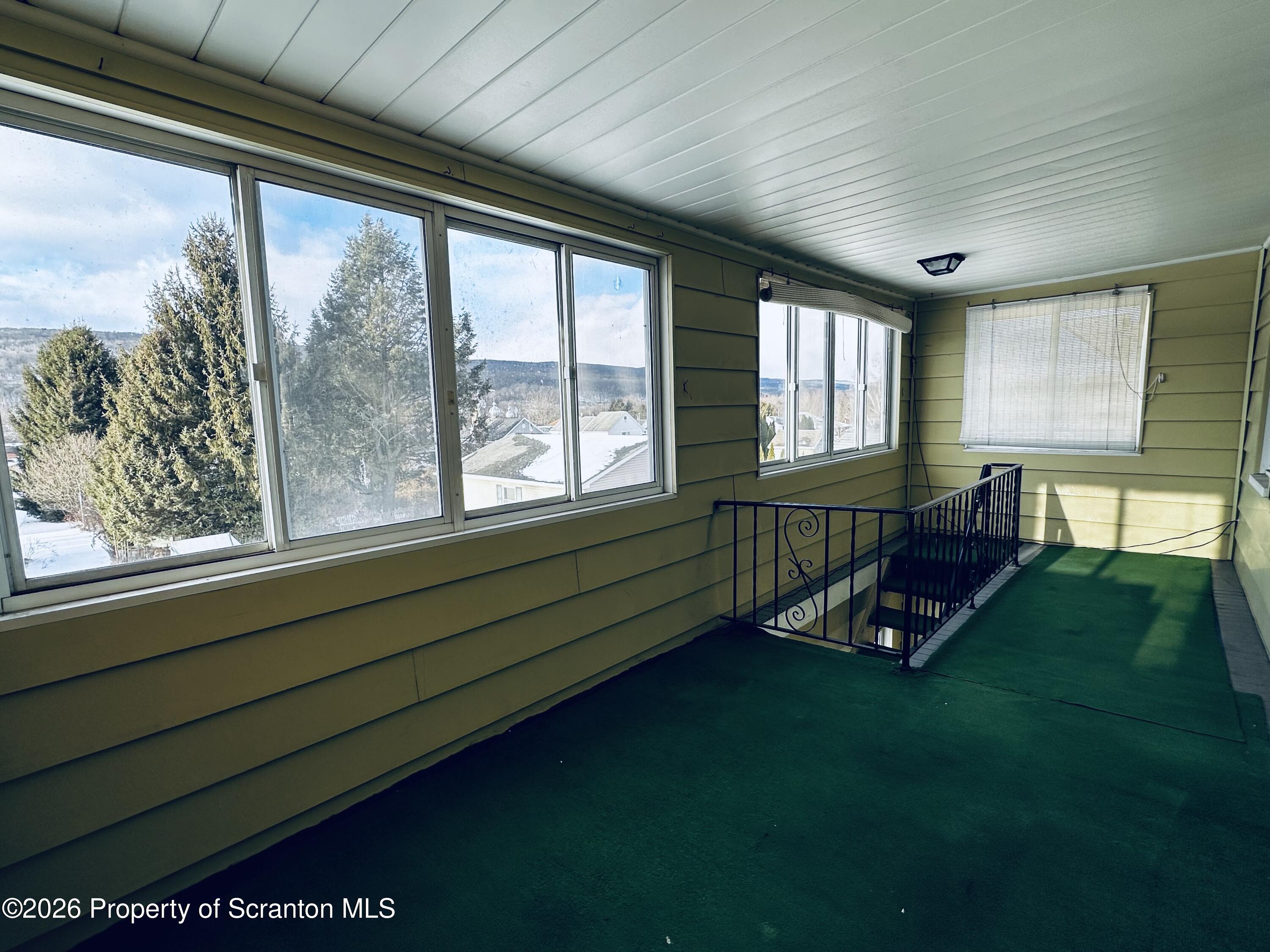 615 Delaware Street Mayfield, PA 18433 - Photo 26 of 29 Rear Upstairs Covered Porch