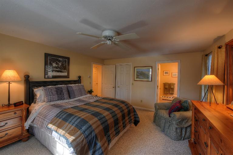 1325 Old Post Road Marstons Mills, MA 02648 - Photo 21 of 35 a bedroom with beds and a chandelier