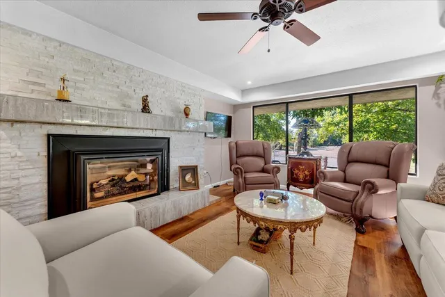 a view of a room that has a bed and a table in it