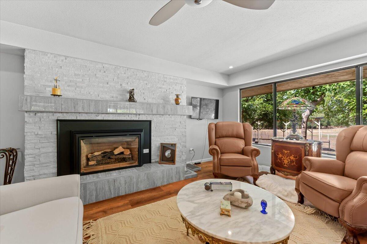 5521 Churn Crk Road Redding, CA 96002 - Photo 19 of 154 a living room with furniture and a fireplace