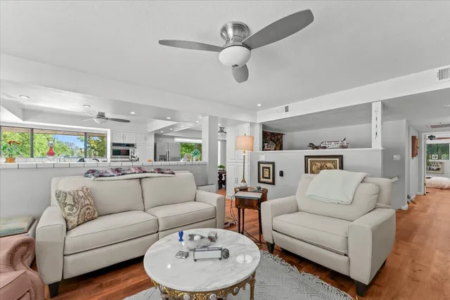 a bedroom with a bed and a large window with the outer view