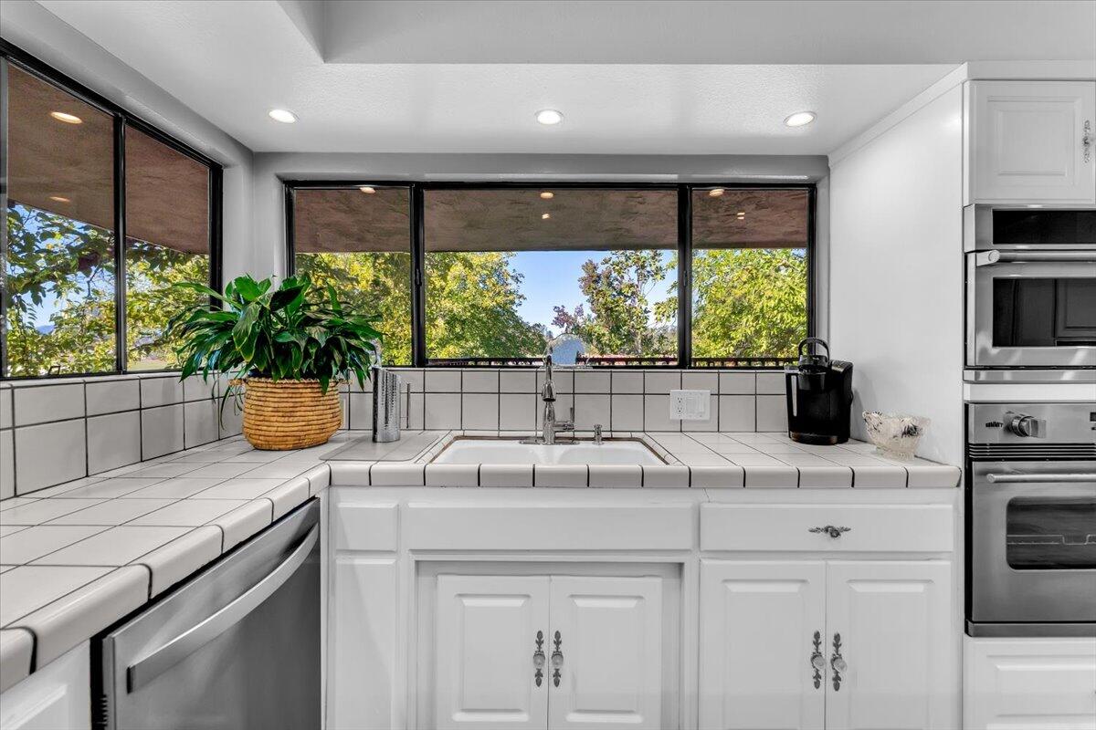 5521 Churn Crk Road Redding, CA 96002 - Photo 31 of 154 a kitchen with a sink and a large window