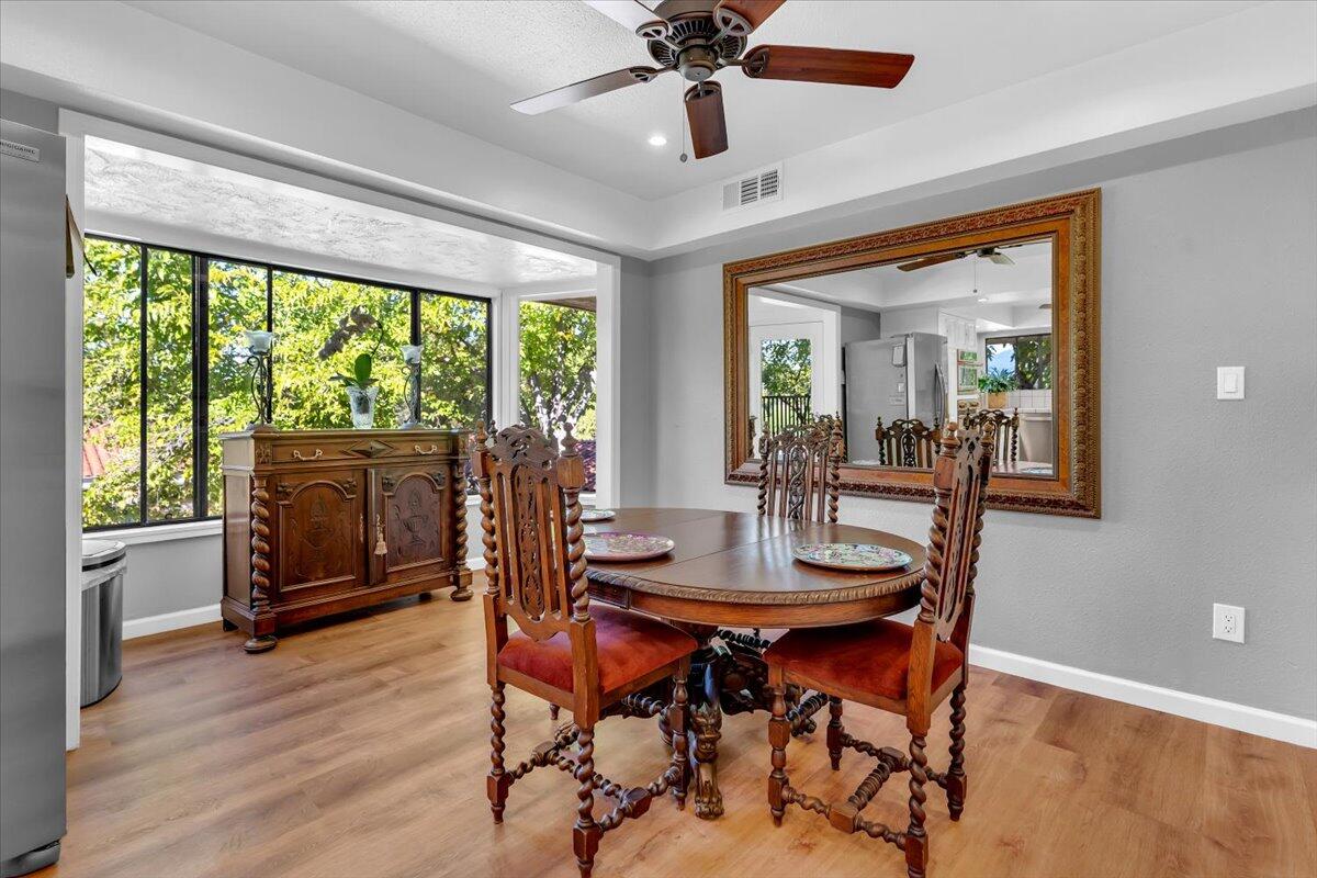 5521 Churn Crk Road Redding, CA 96002 - Photo 38 of 154 a dining room with furniture window and wooden floor