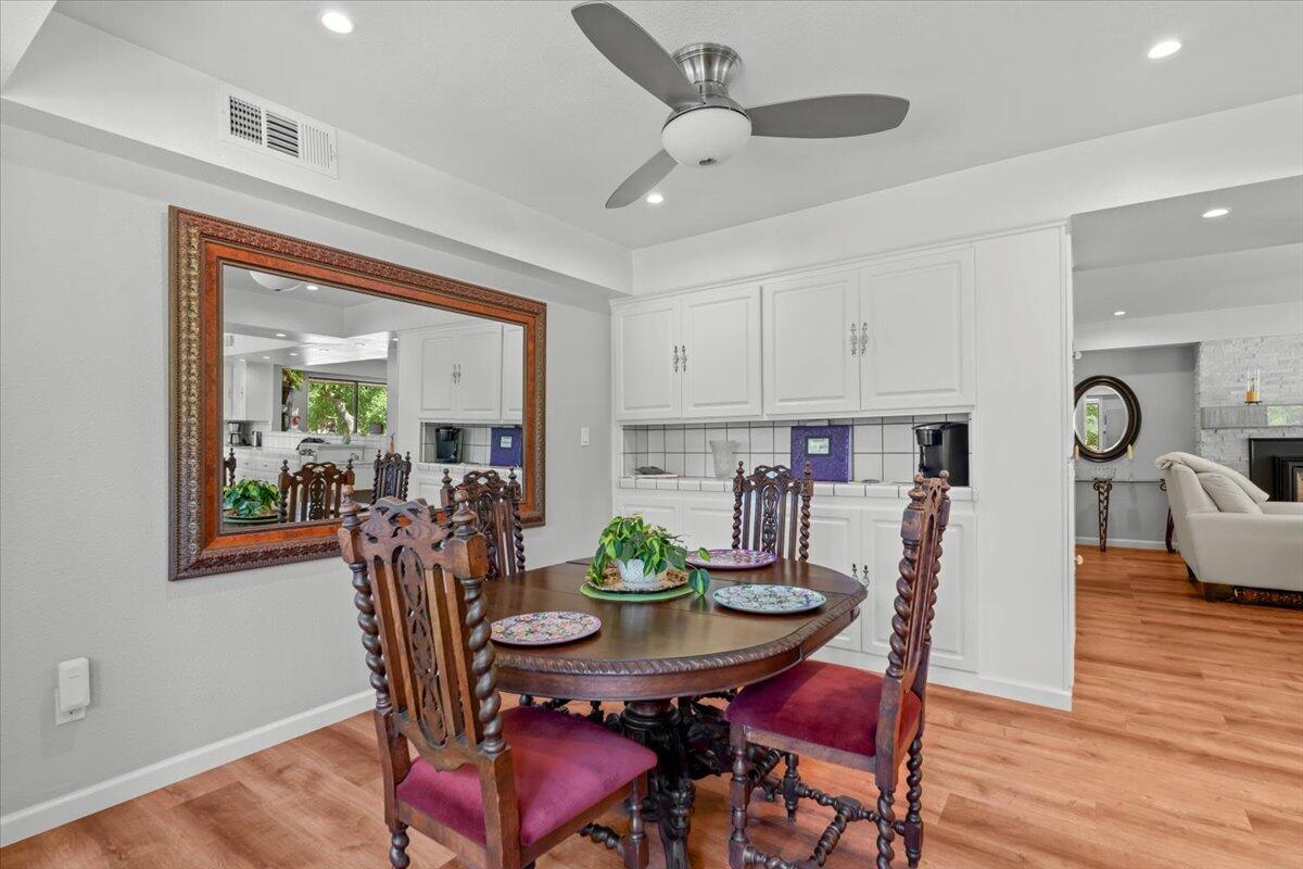 5521 Churn Crk Road Redding, CA 96002 - Photo 40 of 154 a view of a dining room with furniture window and wooden floor