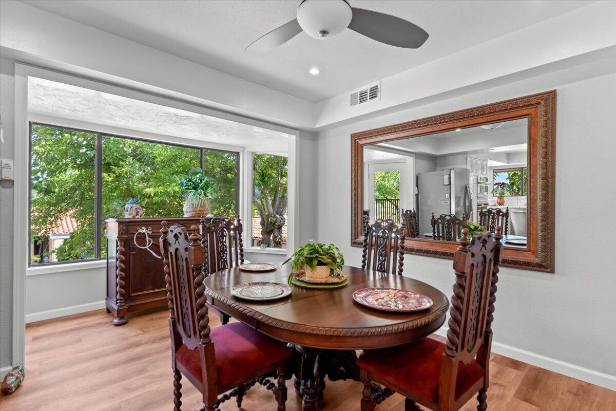 5521 Churn Crk Road Redding, CA 96002 - Photo 41 of 154 a view of a dining room with furniture window and wooden floor