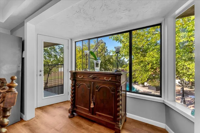 a kitchen with a stove cabinets and wooden floor
