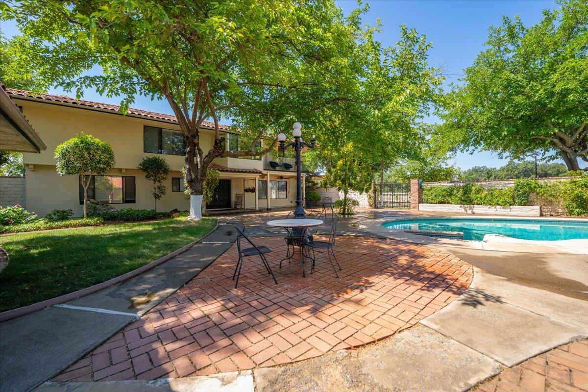 5521 Churn Crk Road Redding, CA 96002 - Photo 64 of 154 a view of a house with backyard and a sitting area